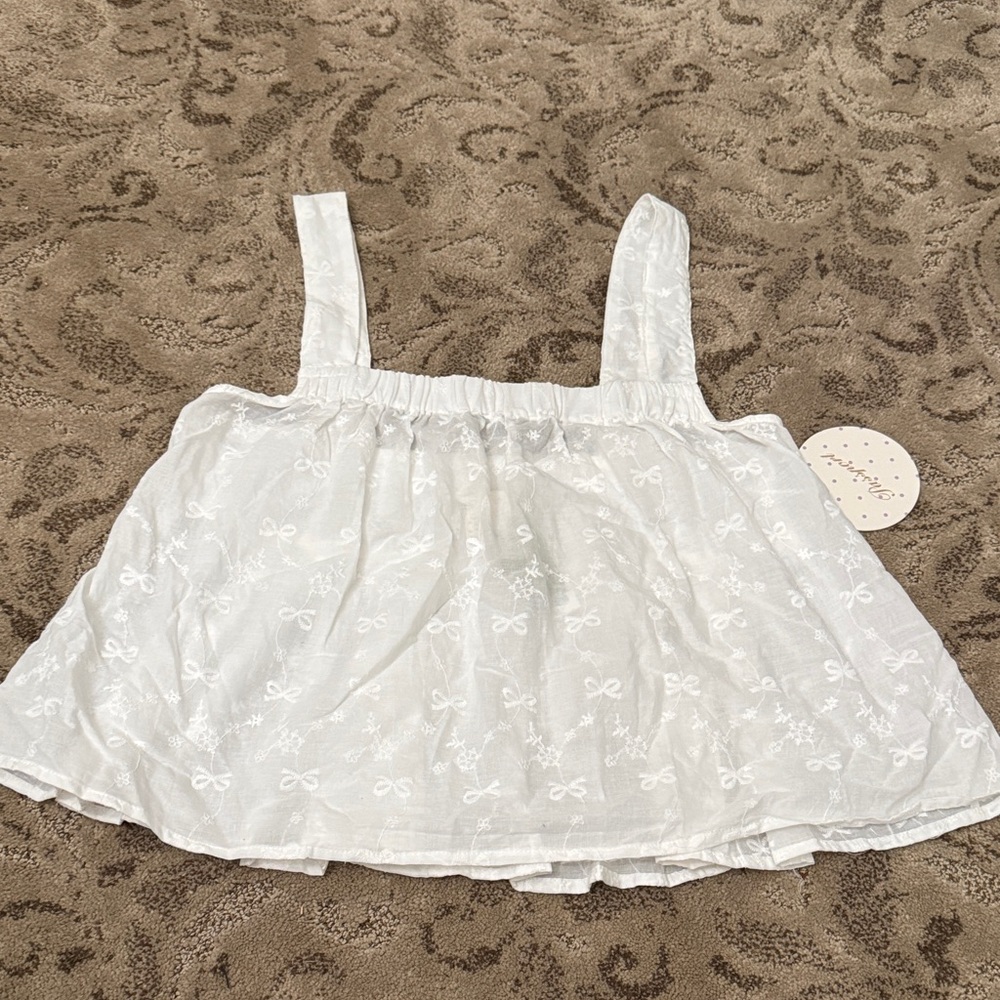 White Sleeveless Top with Bow Pattern